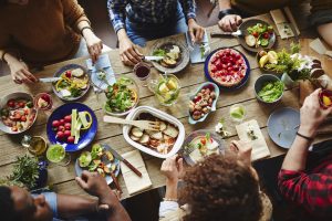 Young people having a good farm dinner